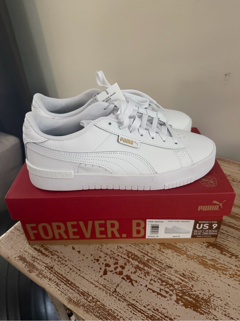 Puma White Low-Top Leather Sneakers with Gold Logo